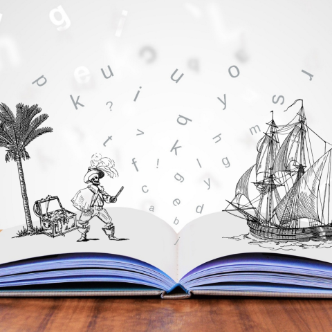 Open book with illustrations of a pirate and ship